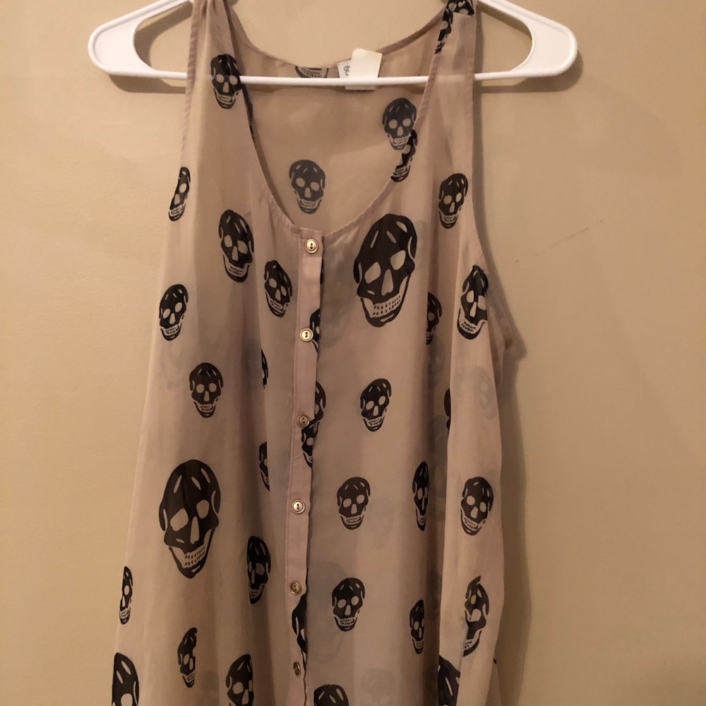 Large sheerish skulls top. Charming Charlie